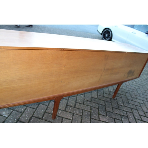 117A - A.H. Mcintosh Of Kirkcaldy retro 1960s teak sideboard raised on tapered legs. Approx 210 x 46 x 76cm... 