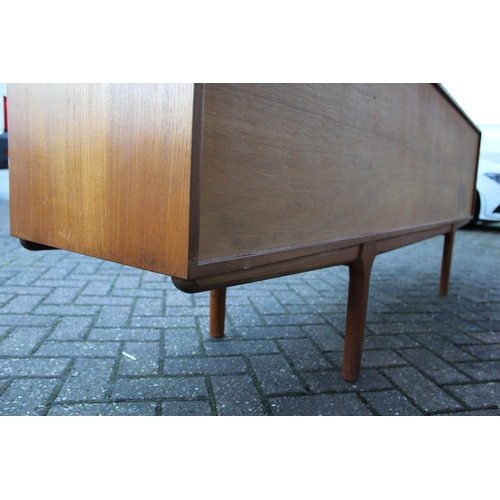 117A - A.H. Mcintosh Of Kirkcaldy retro 1960s teak sideboard raised on tapered legs. Approx 210 x 46 x 76cm... 