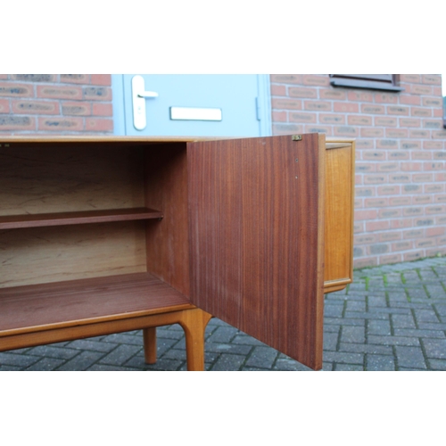 117A - A.H. Mcintosh Of Kirkcaldy retro 1960s teak sideboard raised on tapered legs. Approx 210 x 46 x 76cm... 