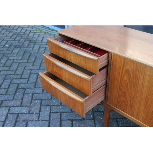 117A - A.H. Mcintosh Of Kirkcaldy retro 1960s teak sideboard raised on tapered legs. Approx 210 x 46 x 76cm... 