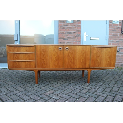 117A - A.H. Mcintosh Of Kirkcaldy retro 1960s teak sideboard raised on tapered legs. Approx 210 x 46 x 76cm... 