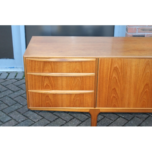 117A - A.H. Mcintosh Of Kirkcaldy retro 1960s teak sideboard raised on tapered legs. Approx 210 x 46 x 76cm... 