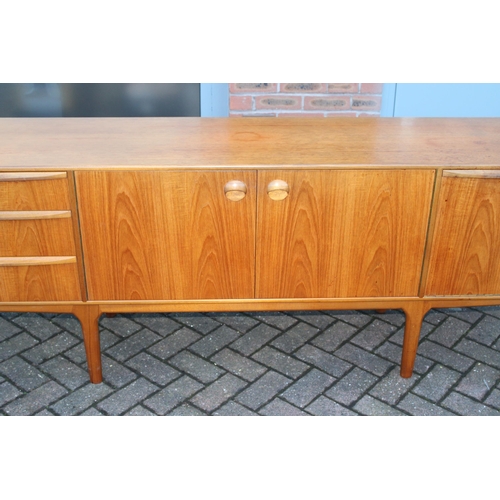 117A - A.H. Mcintosh Of Kirkcaldy retro 1960s teak sideboard raised on tapered legs. Approx 210 x 46 x 76cm... 