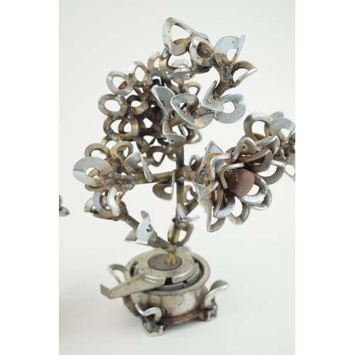 337A - A pair of contemporary metal fabricated floral exhibits, made from washers, bolts and spare metal co... 