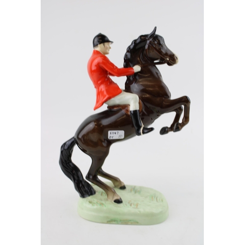 194 - A Beswick rearing Huntsman model number 868. Height 23cm.