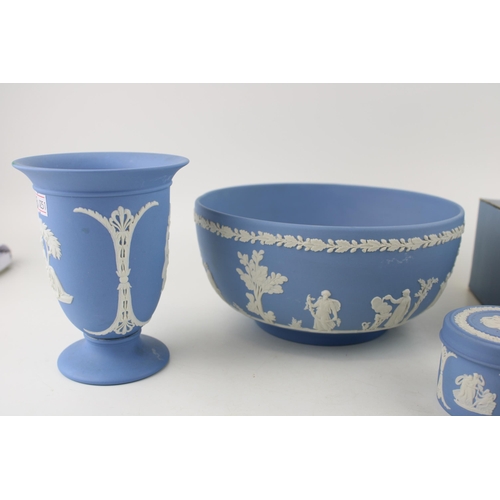 20 - A collection of Wedgwood Jasperware items to include a boxed trio-colour lidded pot, an 8