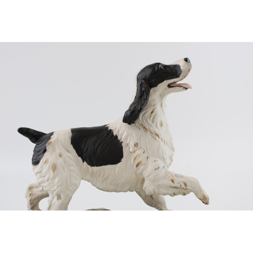 216 - Beswick The Spaniel, on ceramic base (Doulton backstamp).