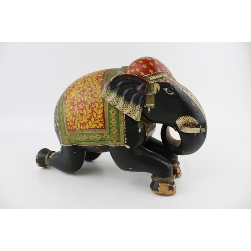 254 - A vintage hand carved, hand painted elephant of Indian origin. Height 20cm.