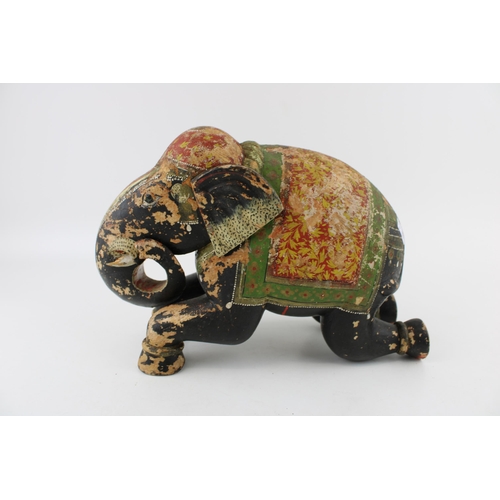 254 - A vintage hand carved, hand painted elephant of Indian origin. Height 20cm.