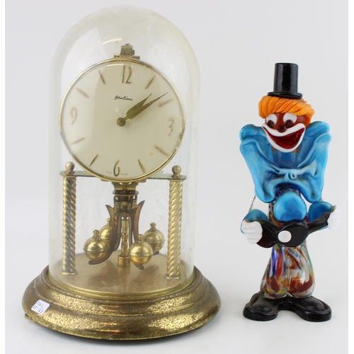 289 - A Bentina millinium clock with brass base and glass dome together with a Murano glass clown. Height ... 