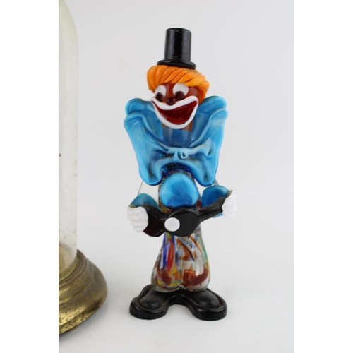 289 - A Bentina millinium clock with brass base and glass dome together with a Murano glass clown. Height ... 