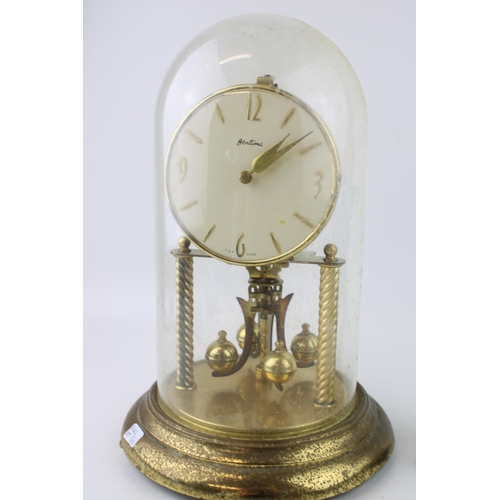 289 - A Bentina millinium clock with brass base and glass dome together with a Murano glass clown. Height ... 