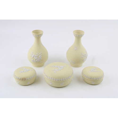 29 - A collection of Wedgwood Jasperware items in Prunus Primrose Yellow to include a pair of bud vases, ... 