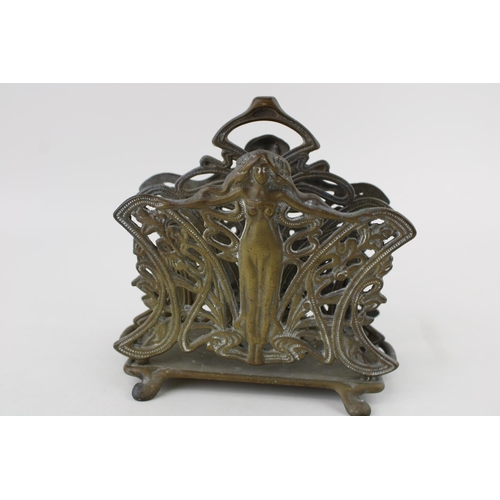 339 - An Art Nouveau style cast brass letter rack, 17cm diameter.