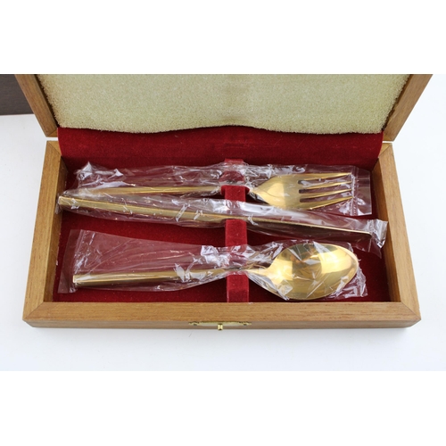 362 - A cased set of bronze cutlery together with an additional box of cutlery. (2)