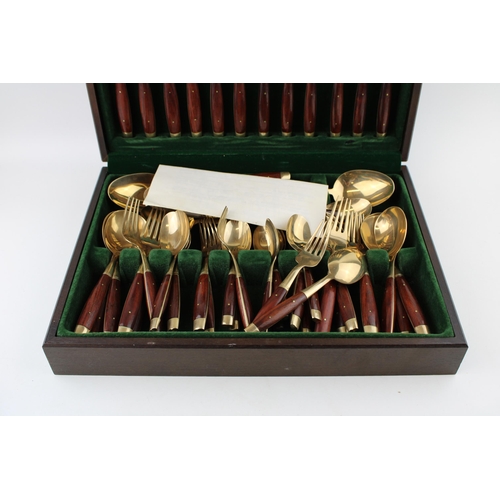 362 - A cased set of bronze cutlery together with an additional box of cutlery. (2)