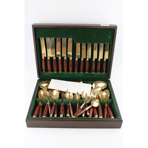 362 - A cased set of bronze cutlery together with an additional box of cutlery. (2)