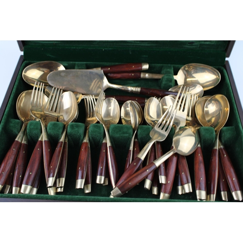 362 - A cased set of bronze cutlery together with an additional box of cutlery. (2)