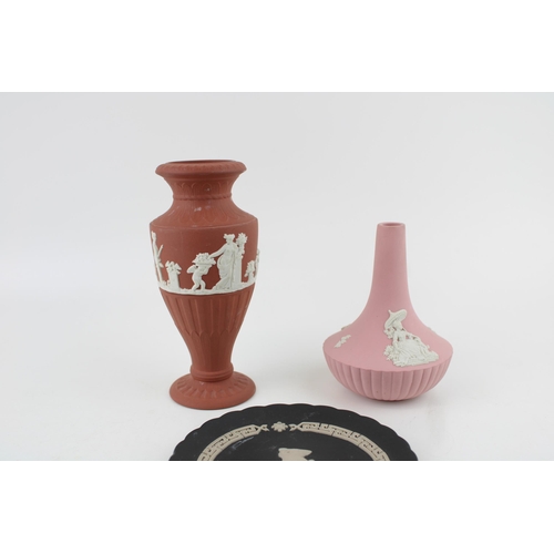 5 - A collection of Wedgwood Jasperware items to include Pink bud vase, Terracotta vase and Black 'Year ... 