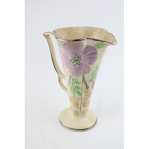 50A - Arthur Woods vase decorated with flowers, 24cm tall.