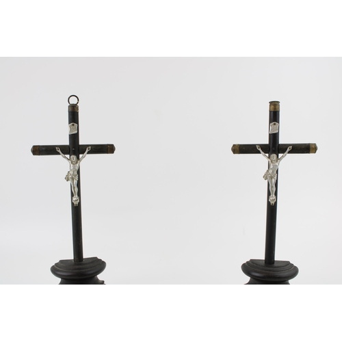 7 - Three vintage wooden crucifix's to include a pair on turned wooden bases together with a wall hangin... 