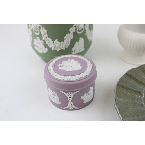 9 - A Wedgwood Jasperware jardinière in Sage Green together with a Lilac lidded pot and two Queensware i... 