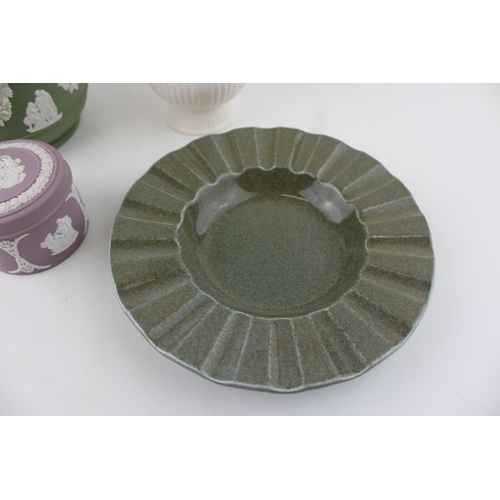 9 - A Wedgwood Jasperware jardinière in Sage Green together with a Lilac lidded pot and two Queensware i... 