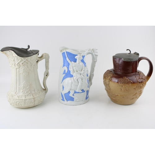 104 - A collection of 19th century pottery jugs to include salt glazed relief pitchers by Doulton, Prattwa... 