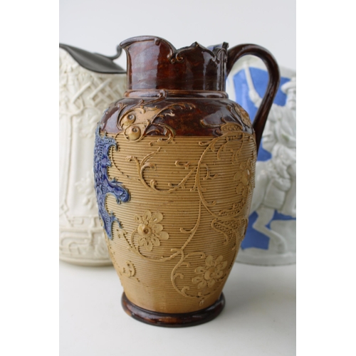 104 - A collection of 19th century pottery jugs to include salt glazed relief pitchers by Doulton, Prattwa... 