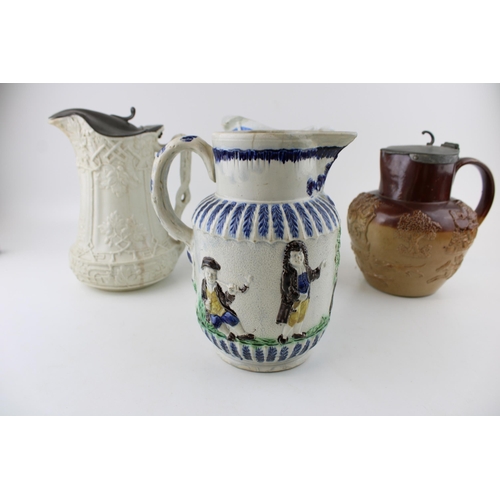 104 - A collection of 19th century pottery jugs to include salt glazed relief pitchers by Doulton, Prattwa... 