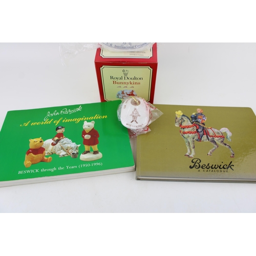 145 - Royal Doulton Bunnykins boxed point of sale and a keyring, with two Beswick catalogues to include 'A... 