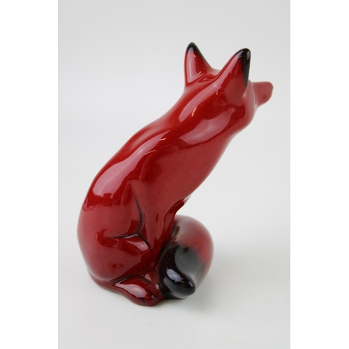 150 - Royal Doulton flambe sitting fox, 11cm tall, centenary edition.