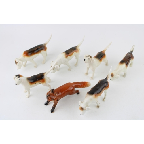 243 - Beswick to include 6 Foxhounds of varying models and a fox (7).