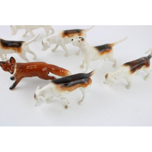 243 - Beswick to include 6 Foxhounds of varying models and a fox (7).