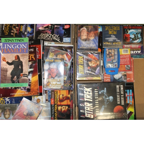 251 - A large quanta of Star Trek memorabilia to include books and publications, tapes and CDs together wi... 