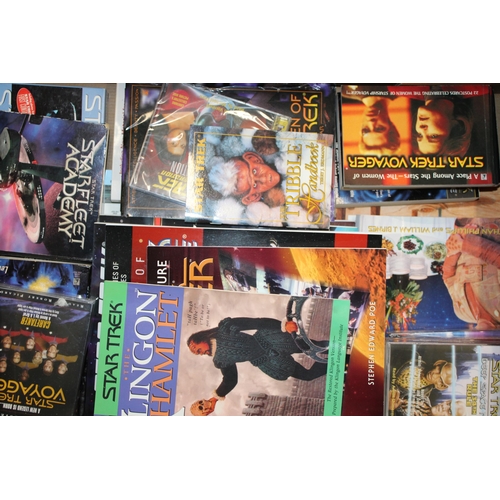 251 - A large quanta of Star Trek memorabilia to include books and publications, tapes and CDs together wi... 