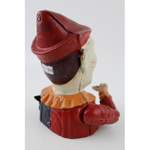 255 - A reproduction cast iron money box in the form of a clowns head. Height 20cm.