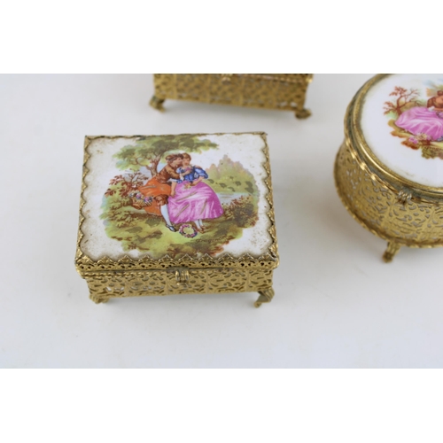 264 - Three vintage jewellery boxes with gilt metal frames and ceramic lids. Height 6cm. (3)