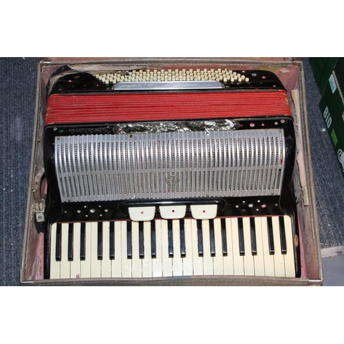 277 - A vintage accordion in original case. Width 57cm height 26cm.