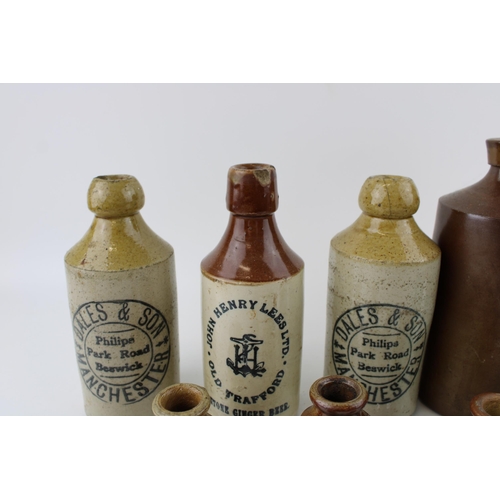 278 - A collection of two-tone stoneware flagons and jars to include John Henry Lees ginger ale, Dales & S... 