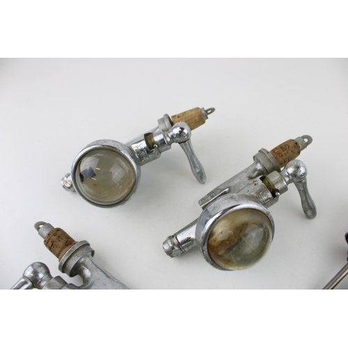 283 - A collection of vintage optics with bullseye lenses and pourers to include 'Optic Pearl' by CASKELL ... 