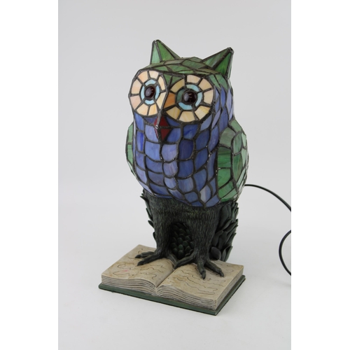 288 - A Tiffany style lamp in the form of an owl sitting on a book. Height 34cm.