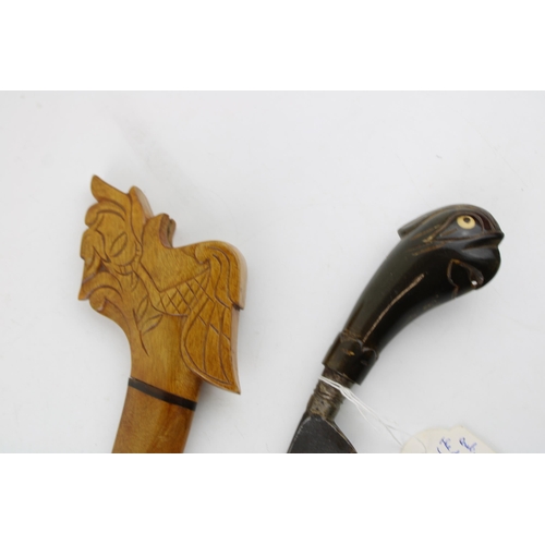 296 - A mid c20th century with  Malayan Kris dagger buffalo horn handle and wooden scabbard