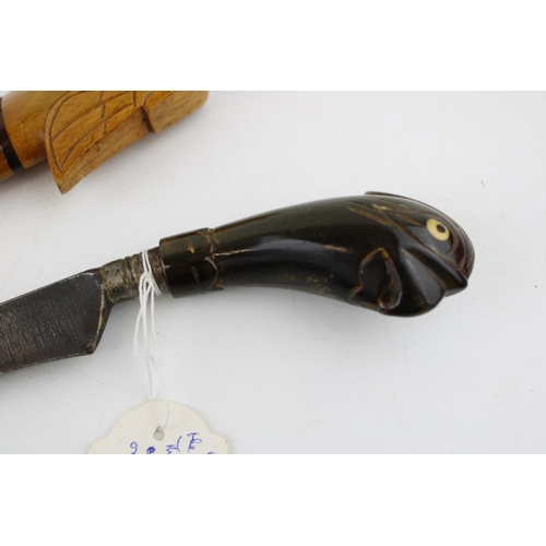 296 - A mid c20th century with  Malayan Kris dagger buffalo horn handle and wooden scabbard