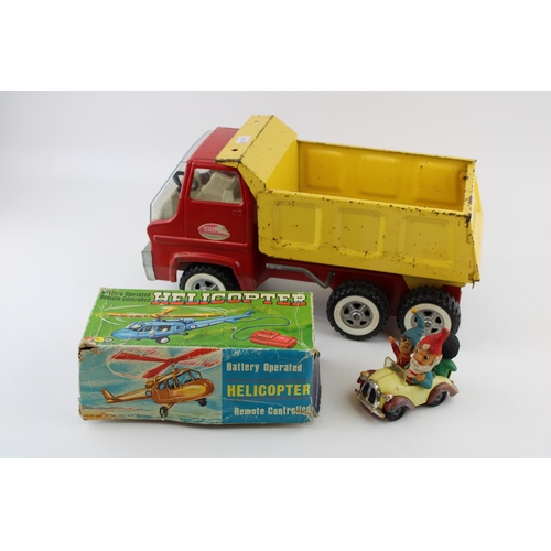 319 - A Tonka tipper truck with a boxed model helicopter c1970s and a Corgi Comics Noddy's Car (3).