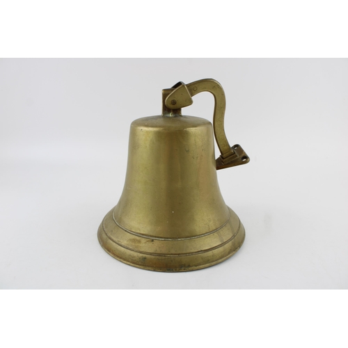 337 - Vintage cast metal bell, wall mount, with clanger, 19cm tall.