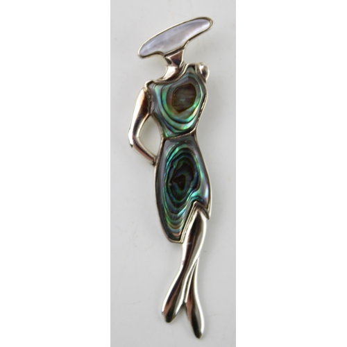 379 - Contemporary sterling silver pendant of an Art Deco style lady, set abalone, 6.5cm long.