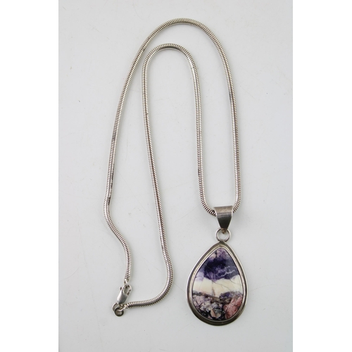 387 - Sterling silver pendant set with blue john style insert on sterling silver necklace.