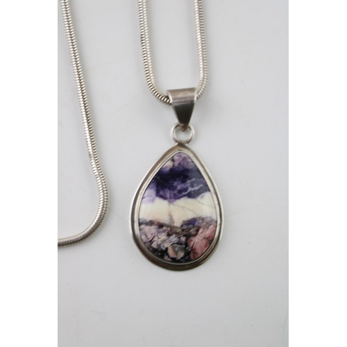 387 - Sterling silver pendant set with blue john style insert on sterling silver necklace.