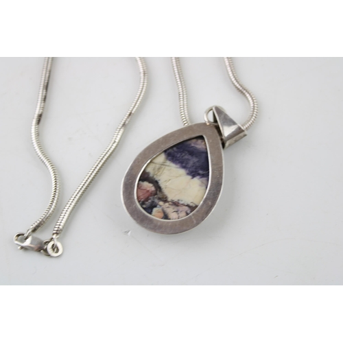 387 - Sterling silver pendant set with blue john style insert on sterling silver necklace.